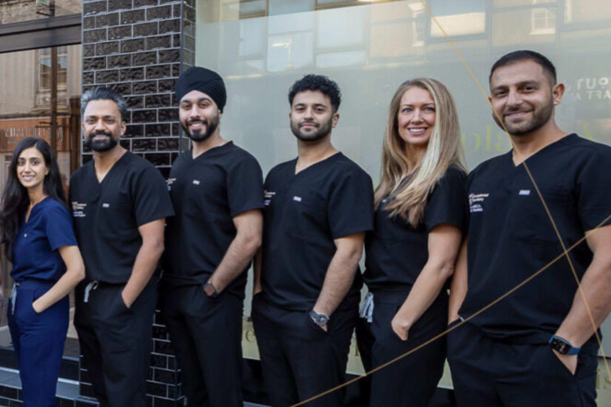 SmileHQ dental team Brentwood Essex dental implant specialists group outside clinic professional team