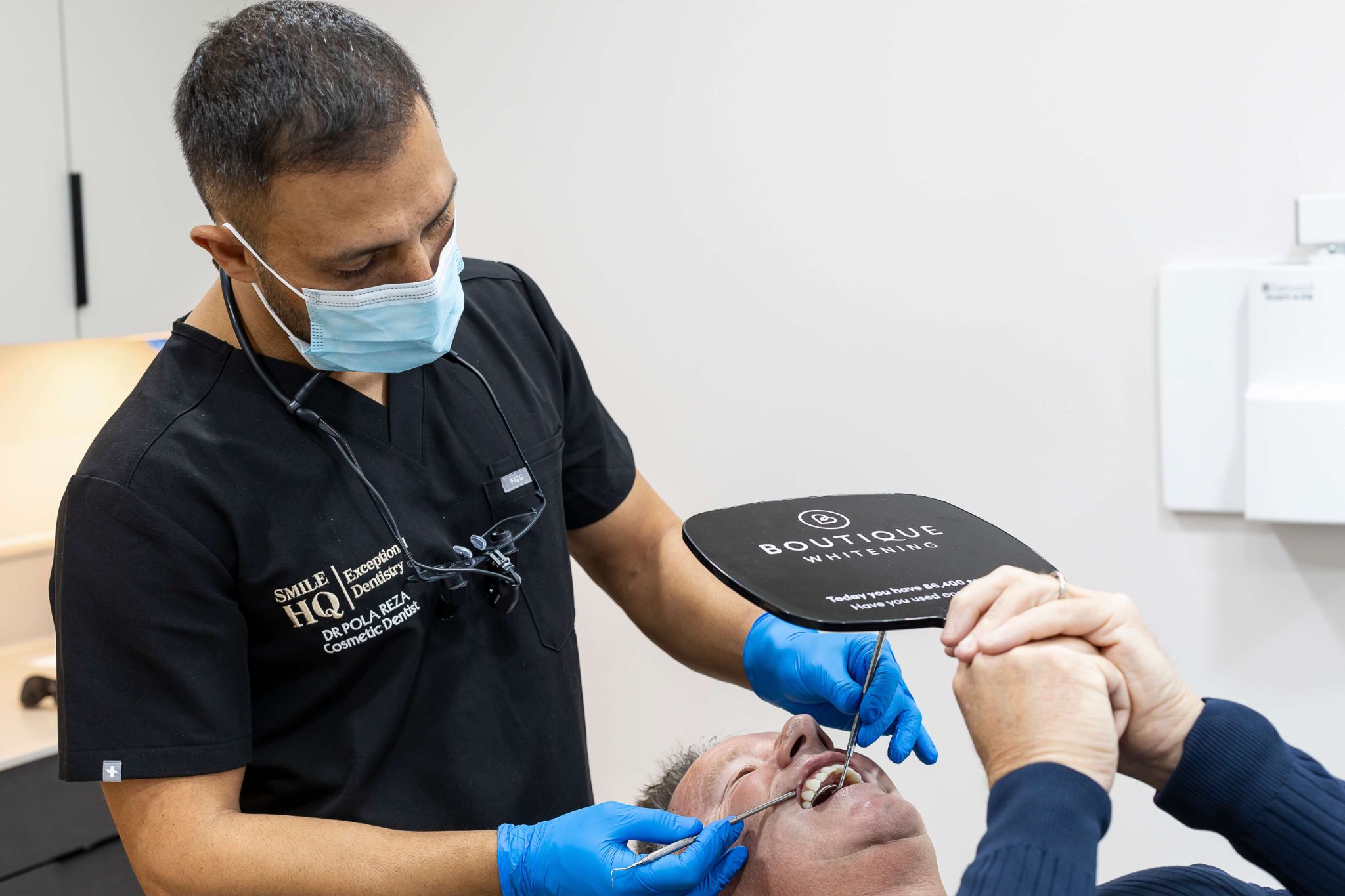 Dr Pola Reza performing professional teeth whitening treatment at SmileHQ in Essex