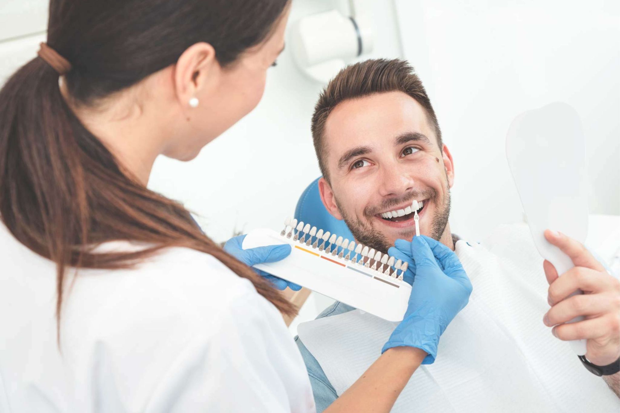 Using shade guide to assess tooth colour before teeth whitening treatment