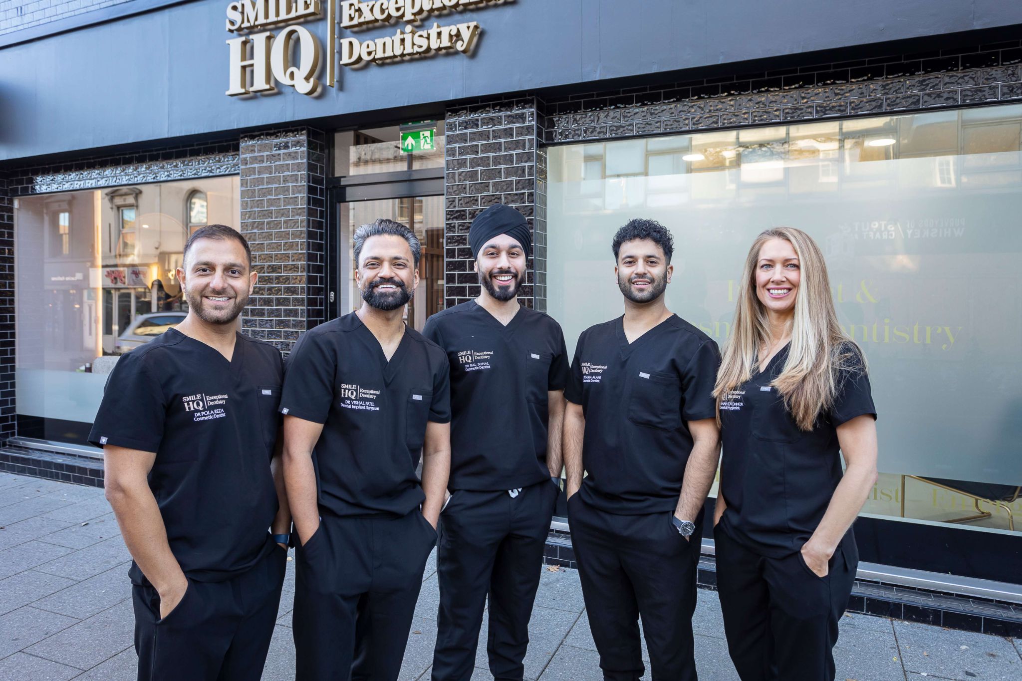 SmileHQ dental team including Dr Pola Reza, Dr Vishal Patel, Dr Bal, Dr Sasha Alani and dental hygienist Hannah outside Essex practice offering teeth whitening services