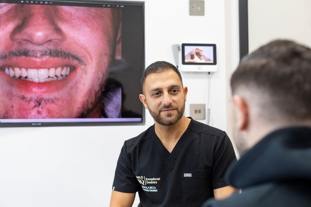 Dr Pola Reza discussing composite bonding treatment with a patient at SmileHQ Essex