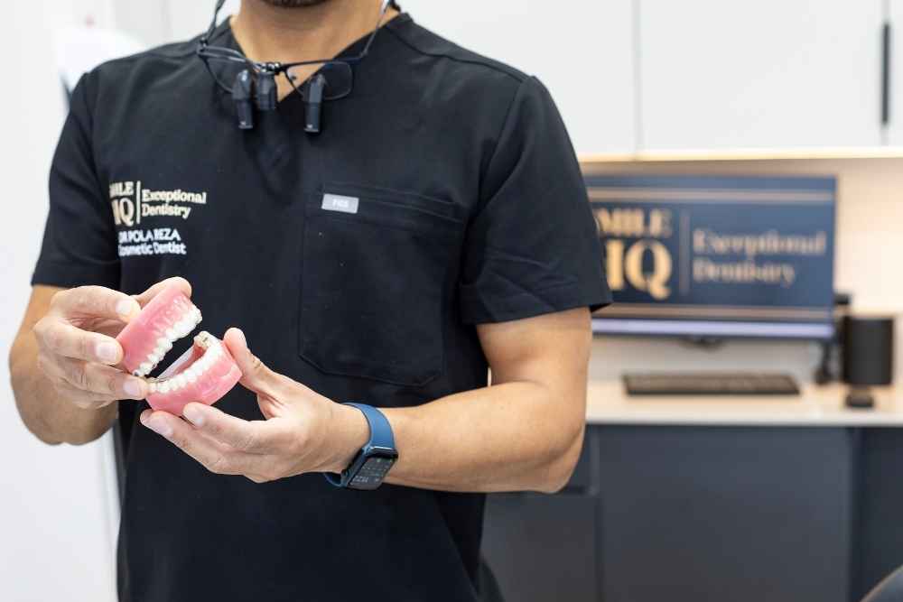 Dentist demonstrating teeth grinding and bruxism treatment at SmileHQ Brentwood