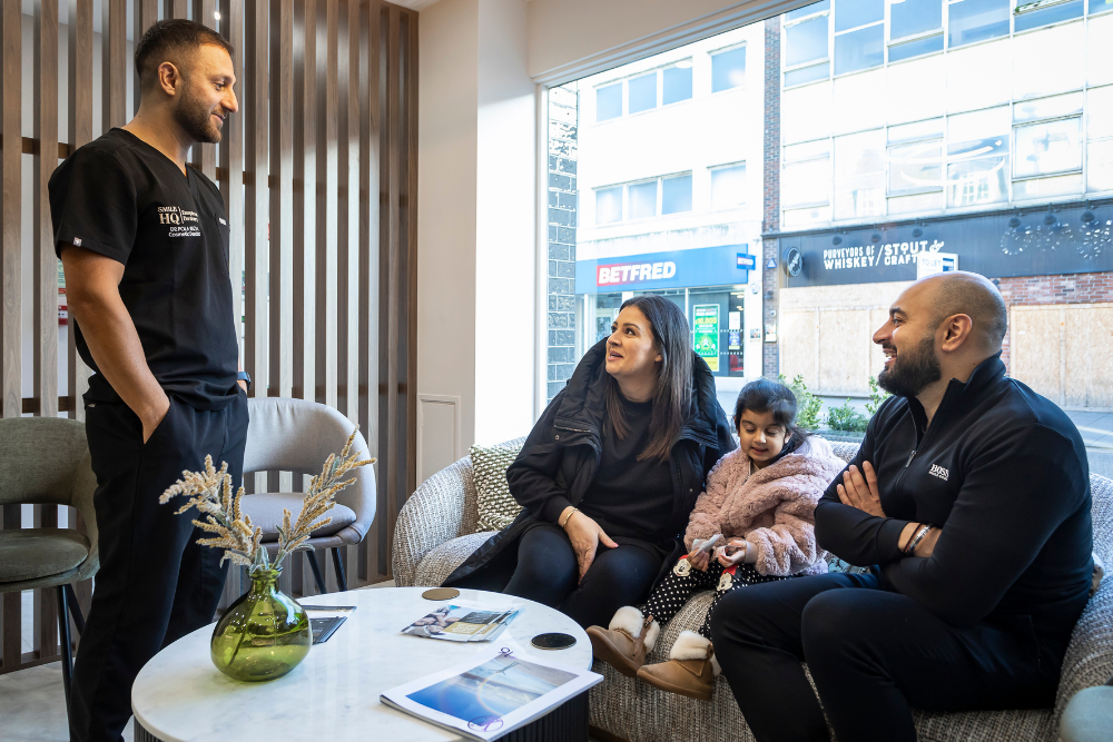 SmileHQ dentist Dr Pola talking with a family at the Brentwood practice